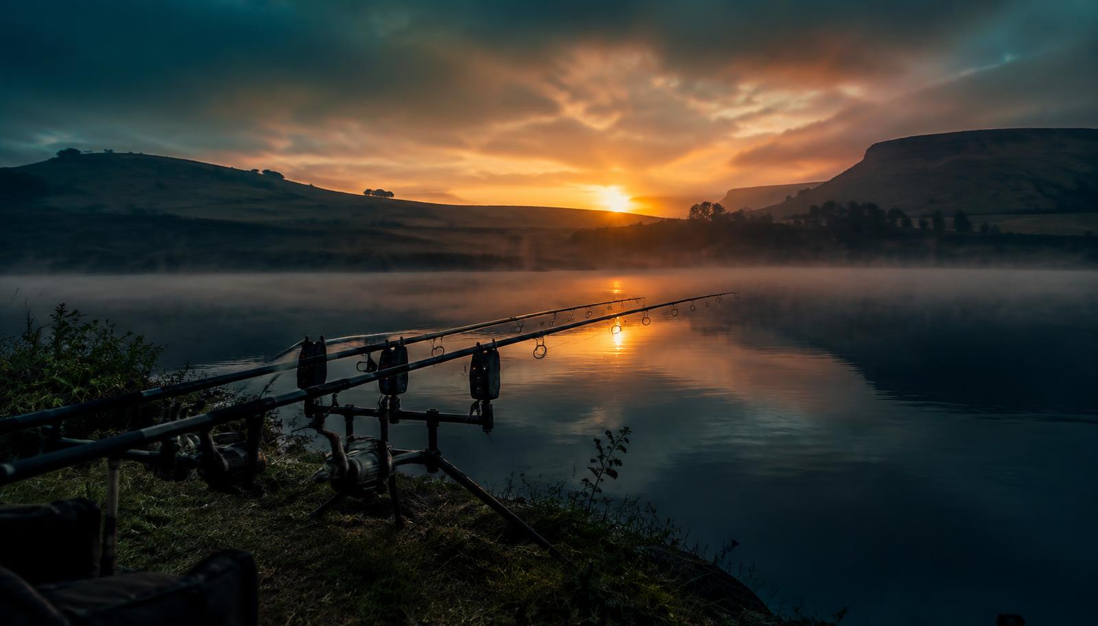 Carp rods at dawn on a misty dam